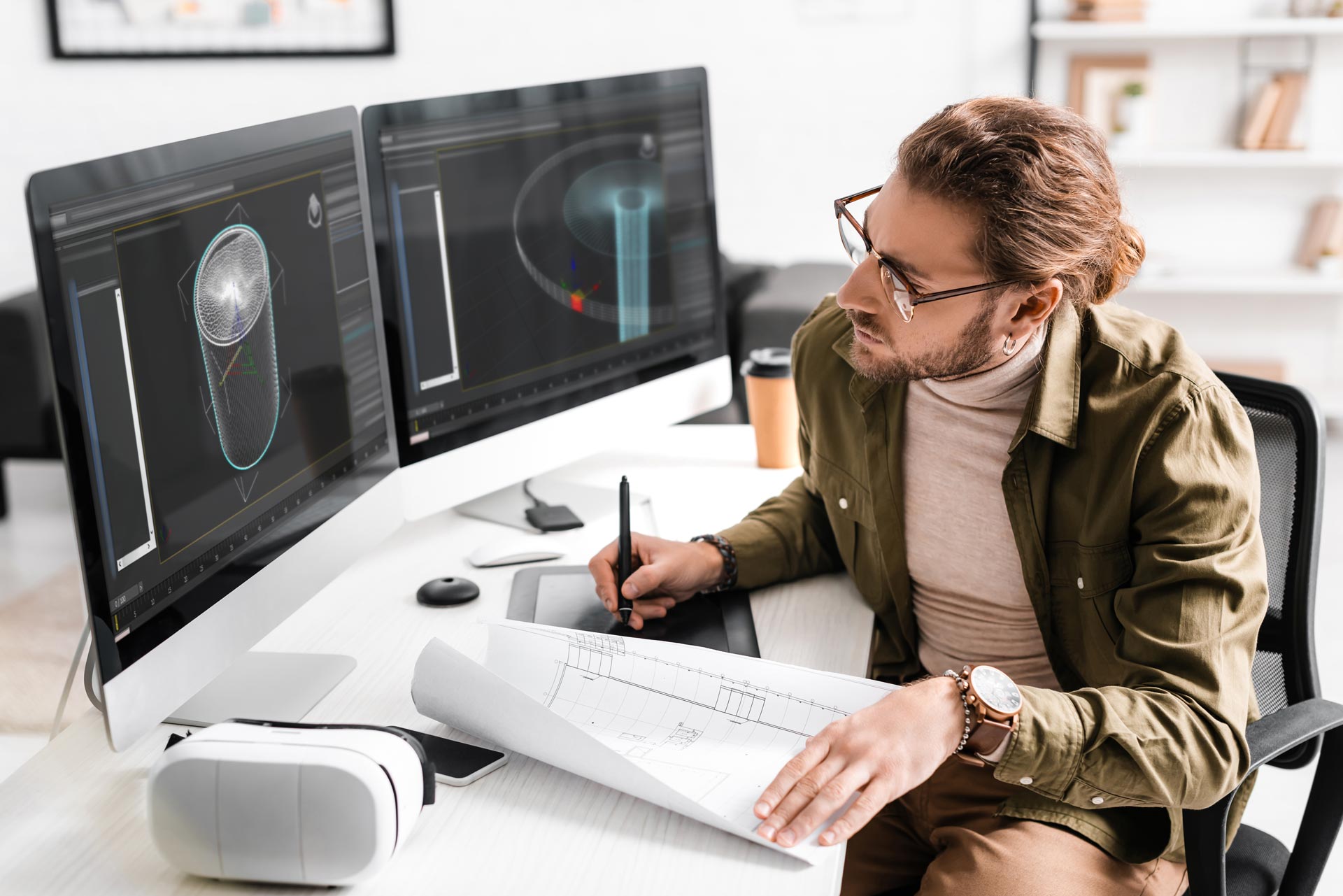 3D artist using a blueprint and graphics tablet for concept design at Robust3D
